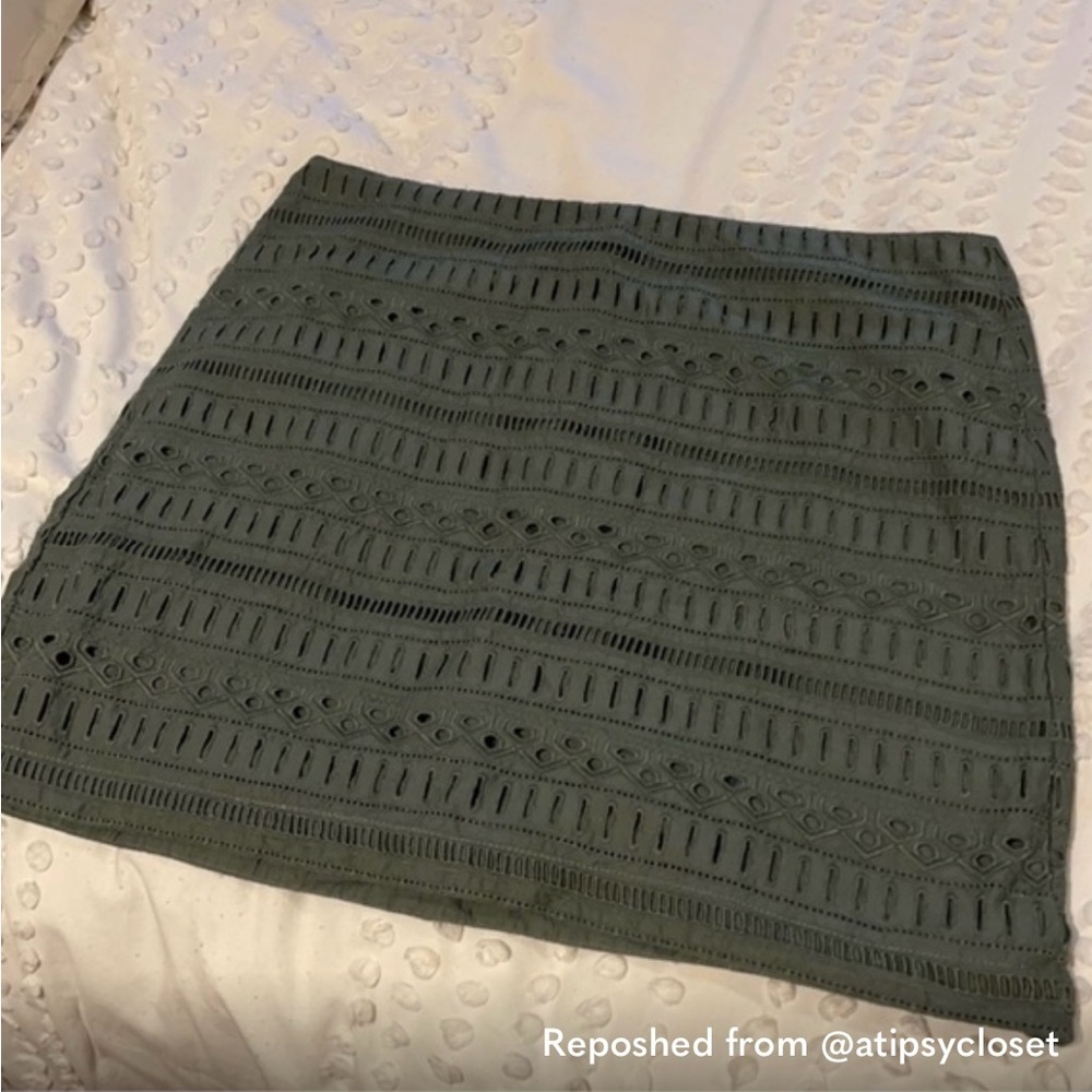 Green eyelet mini skirt